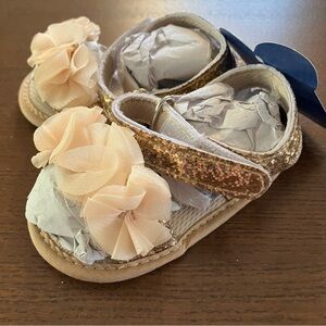 Sparkling Gold Baby Sandals with Floral Design